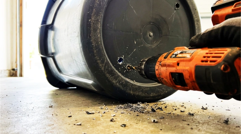 Drill Two Holes Under Your Trash Bins